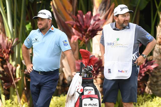 Graeme McDowell, left, with his caddie Ken Comboy who has tested positive for Covid-19.
