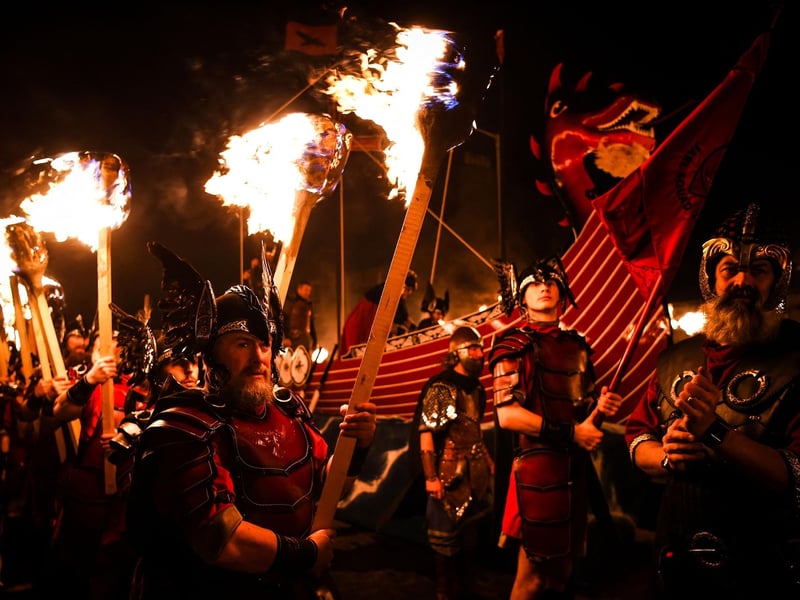 The event, which attracts visitors from around the globe, sees people dressed as Vikings march through the streets of Lerwick to recreate its ancient Viking past, in a tradition dating back to the 19th century.
(Photo by Andy Buchanan / AFP)