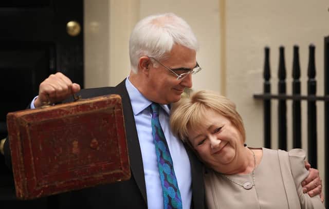 Alistair Darling hugs wife Maggie outside number 11 Downing Street on 24 March 2010 before presenting his last Budget as Labour Chancellor of the Exchequer (Picture: Peter Macdiarmid/Getty Images)