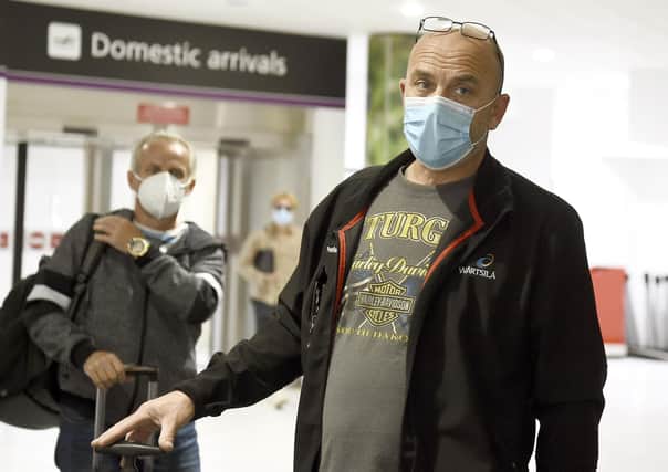 Passengers arriving at Edinburgh Airport on Monday as the quarantine restrictions were introduced. Picture: Lisa Ferguson.