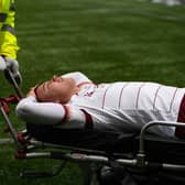Dylan Tait is stretchered off during a cinch Championship match between Raith Rovers and Arbroath.