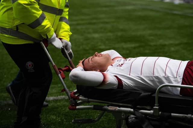 Dylan Tait is stretchered off during a cinch Championship match between Raith Rovers and Arbroath.