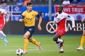 Union's Belgian forward Dante Vanzeir and Rangers' Finnish midfielder Glen Kamara fight for the ball during the UEFA Champions League third qualifying round first leg  (Photo by LAURIE DIEFFEMBACQ/BELGA/AFP via Getty Images)