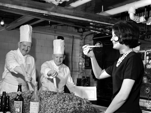 340lb Christmas pudding being mixed by Pastry chef Danny Morton (left) with second chef William Milne at the Caledonian Hotel, Edinburgh. Tested by receptionist Olivia Renylel.