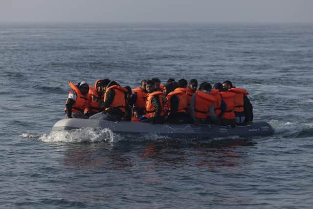 An inflatable craft carrying migrant men, women and children across the English Channel  (Photo by Dan Kitwood/Getty Images)