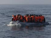 An inflatable craft carrying migrant men, women and children across the English Channel  (Photo by Dan Kitwood/Getty Images)