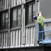 Workers remove cladding for testing from a tower block in the wake of the Grenfell Tower tragedy. Picture: Christopher Furlong/Getty Images