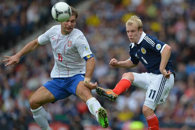 Steven Naismith tackles Branislav Ivanovic when the nations met at Hampden in 2012 (Photo by Jeff J Mitchell/Getty Images)