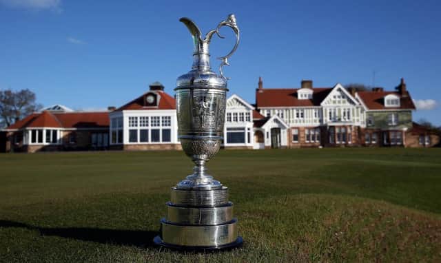 The Claret Jug sits beside the 18th green in front of the clubhouse at Muirfield, where The Open was last held in 2013. Picture: Ross Kinnaird/Getty Images.