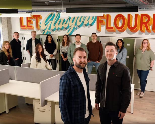 Gigged.AI co-founders Rich Wilson and Craig Short with staff members at the company's Glasgow hub. Picture: Stewart Attwood