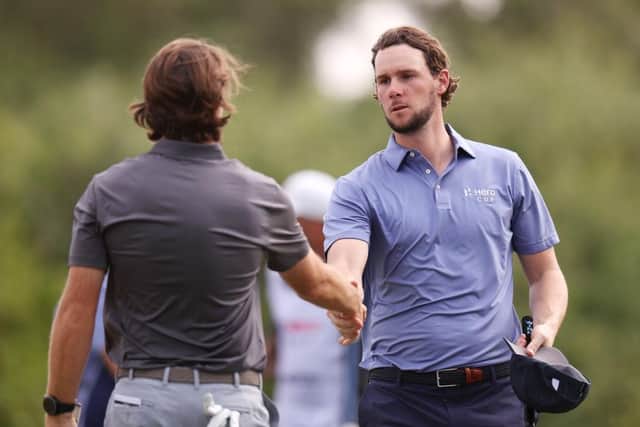Thomas Pieters of Continental Europe shakes hands with Tommy Fleetwood, captain of Great Britain & Ireland, after losing to the Englishman in the final-day singles in  the Hero Cup at Abu Dhabi Golf Club last month. Oisin Keniry/Getty Images.