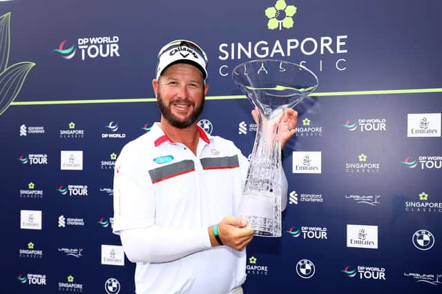 Ockie Strydom gets his hands on the trophy after wnning the Singapore Classic at Laguna National Golf Resort Club. Picture: Yong Teck Lim/Getty Images.