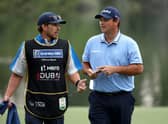 Patrick Reed speaks with his caddie during the opening round of the Hero Dubai Desert Classic at Emirates Golf Club. Picture: Warren Little/Getty Images.