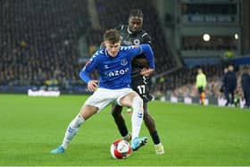 Everton's Nathan Patterson holds off Boreham Wood's Jacob Mendy during the English FA Cup 5th round tie between Everton and Boreham Wood at Goodison Park. Photo by Jon Super/AP/Shutterstock (12832490b)
