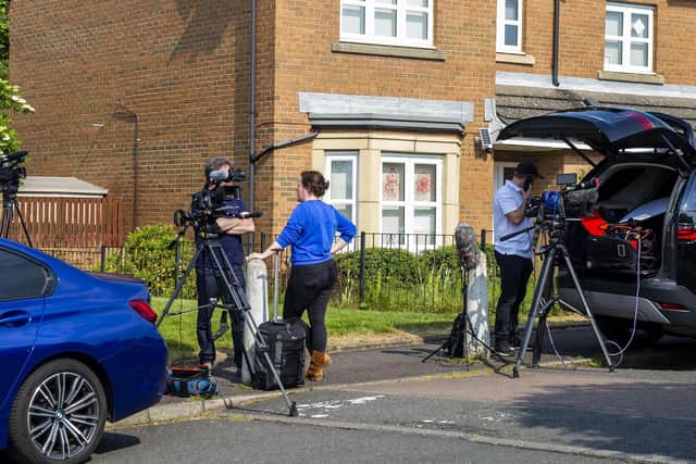 Media outside the former first minister's home on Sunday