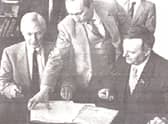 1991 visit: Vladimir Putin (standing) with East Lothian Council chairman George Wanless (left) and Mayor of Leningrad Anatoly Sobchak.