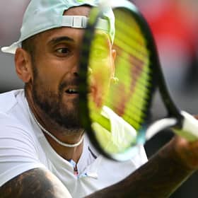 Nick Kyrgios lets his tennis do the talking to progress to the Wimbledon quarter-finals.
