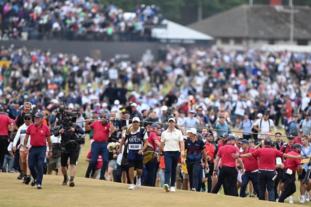 Rory McIlroy and his caddie Harry Diamond walk to the 18th green during the final round of the 150th Open at St Andrews. Picture: Ian Rutherford.