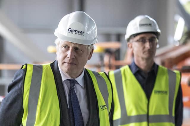 Prime Minister Boris Johnson visits the construction site of the new vaccines Manufacturing and Innovation Centre (VMIC) currently under construction on the Harwell science and innovations campus near Didcot