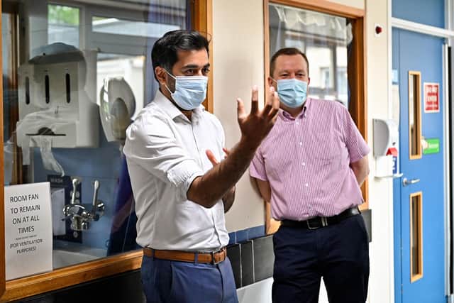 Scotland's clinical director Jason Leitch, right, seen with Health Secretary Humza Yousaf (Picture: Jeff J Mitchell/pool/AFP via Getty Images).