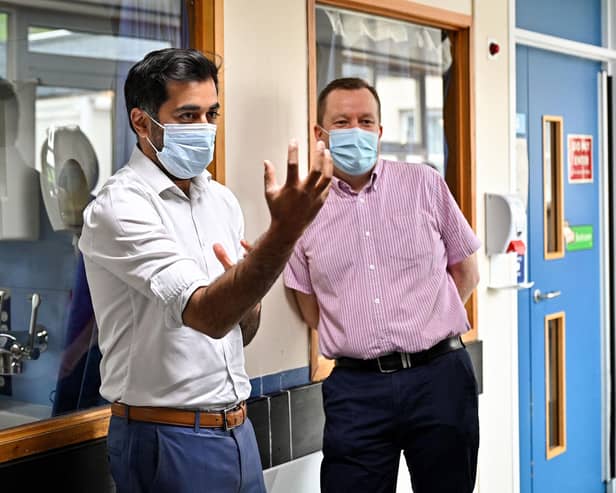 Scotland's clinical director Jason Leitch, right, seen with Health Secretary Humza Yousaf (Picture: Jeff J Mitchell/pool/AFP via Getty Images).