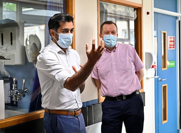 Scotland's clinical director Jason Leitch, right, seen with Health Secretary Humza Yousaf (Picture: Jeff J Mitchell/pool/AFP via Getty Images).