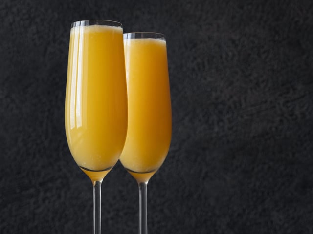 People often think that the Mimosa and Buck's Fizz are the same drink, but they are very slightly different. It's still a mix of fizzy wine and orange juice but to make a Buck's Fizz only champagne is acceptable, while the mix is two parts champagne to one part orange juice (rather than the 50/50 mix of the Mimosa).