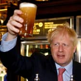 Another Conservative MP has called for Boris Johnson to resign as it is understood the Met Police have a picture of Mr Johnson holding a pint at a lockdown party.