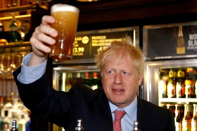 Another Conservative MP has called for Boris Johnson to resign as it is understood the Met Police have a picture of Mr Johnson holding a pint at a lockdown party.