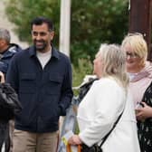 First Minister Humza Yousaf whilst handing out leaflets with SNP candidate for the potential Rutherglen and Hamilton West by-election, Katy Loudon during a visit to Blantyre