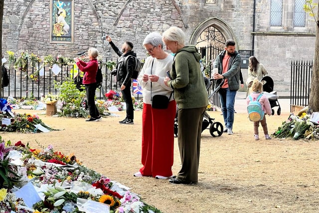 People have been leaving flowers and messages at the palace in Edinburgh.