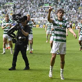 Matt O'Riley, centre, and captain Callum McGregor lead the celebrations after defeating Rangers 2-1 at Parkhead.