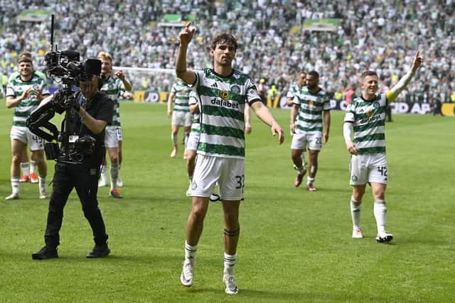 Matt O'Riley, centre, and captain Callum McGregor lead the celebrations after defeating Rangers 2-1 at Parkhead.