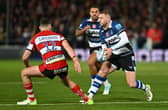 Finn Russell of Bath takes on Seb Atkinson of Gloucester during the Gallagher Premiership encounter.