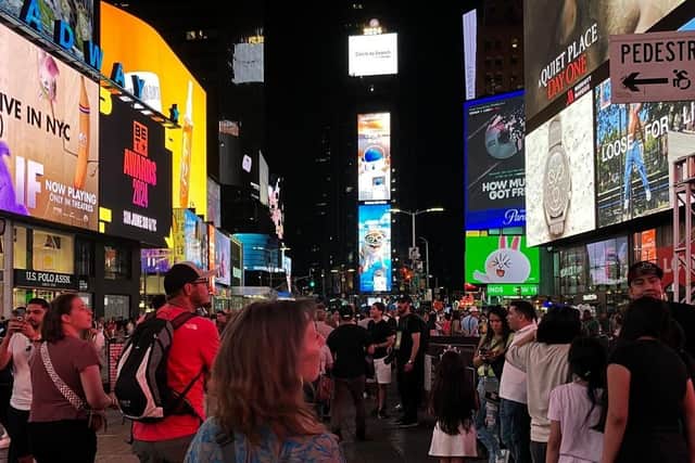 Gazing at the bright lights in Times Square, the beating heart of New York, at night. Pic: H Adam