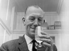 Glenlivet Distillery manager Robert Arthur enjoys a little quality control - by tasting a dram of whisky.