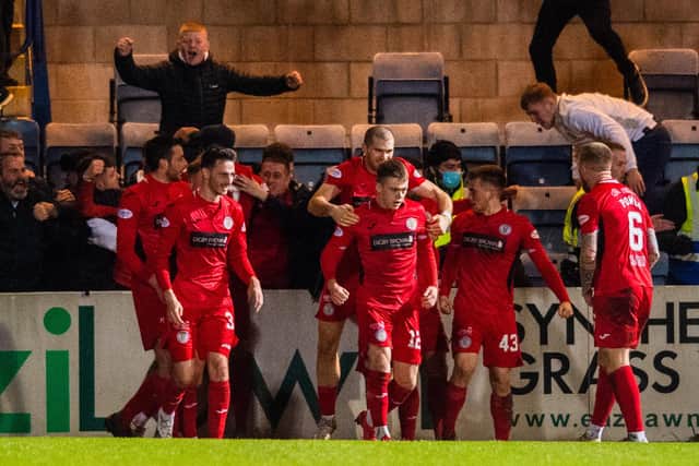 St Mirren players celebrate Connor Ronan's injury-time winner against Dundee at Dens Park.