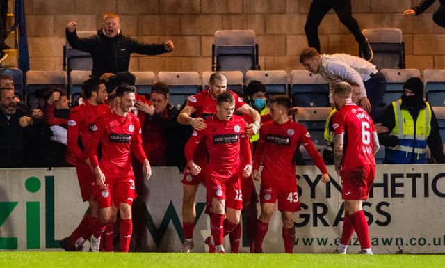 St Mirren players celebrate Connor Ronan's injury-time winner against Dundee at Dens Park.