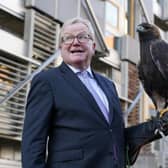 Jackson Carlaw MSP, Convener of the Scottish Parliament’s Citizen Participation and Public Petitions Committee with 15-year-old male golden eagle, Stanley, at the Scottish Parliament in Edinburgh.