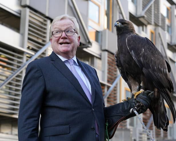 Jackson Carlaw MSP, Convener of the Scottish Parliament’s Citizen Participation and Public Petitions Committee with 15-year-old male golden eagle, Stanley, at the Scottish Parliament in Edinburgh.
