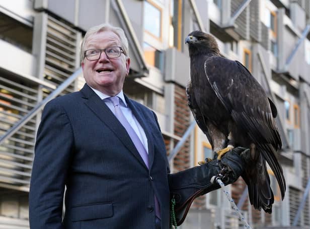 Jackson Carlaw MSP, Convener of the Scottish Parliament’s Citizen Participation and Public Petitions Committee with 15-year-old male golden eagle, Stanley, at the Scottish Parliament in Edinburgh.