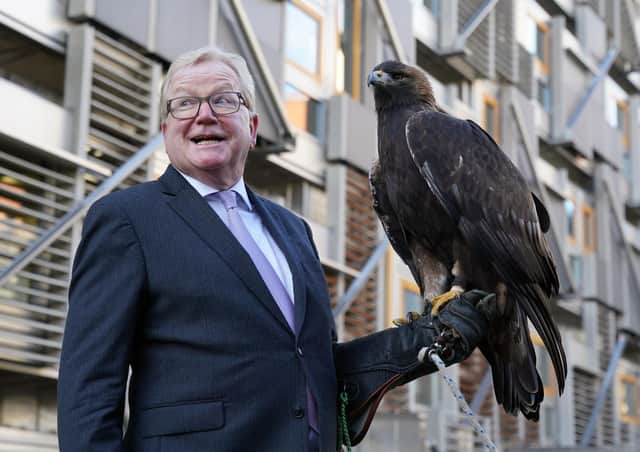 Jackson Carlaw MSP, Convener of the Scottish Parliament’s Citizen Participation and Public Petitions Committee with 15-year-old male golden eagle, Stanley, at the Scottish Parliament in Edinburgh.