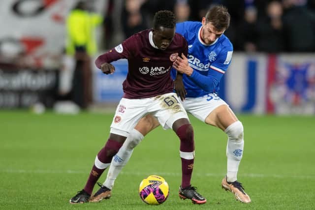 Hearts' Garang Kuol holds off Rangers' Borna Barisic during the match at Tynecastle. (Photo by Mark Scates / SNS Group)