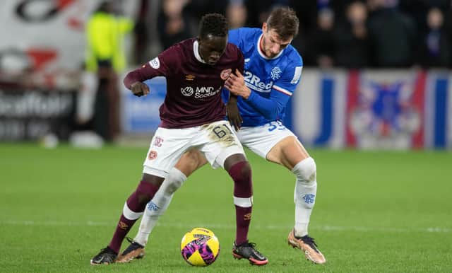 Hearts' Garang Kuol holds off Rangers' Borna Barisic during the match at Tynecastle. (Photo by Mark Scates / SNS Group)