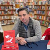 Joseph Fasano posing with copies of his book 'The Swallows of Lunetto'. Joseph who flew to Scotland to promote his latest novel enjoyed a "very funny moment" when he noticed the stranger sitting next to him on the flight was reading his new book.