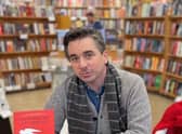 Joseph Fasano posing with copies of his book 'The Swallows of Lunetto'. Joseph who flew to Scotland to promote his latest novel enjoyed a "very funny moment" when he noticed the stranger sitting next to him on the flight was reading his new book.