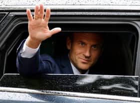 France's president Emmanuel Macron waves as he leaves after casting his vote in the second stage of French parliamentary elections at a polling station in Le Touquet, northern France on Sunday. Picture: AFP via Getty Images