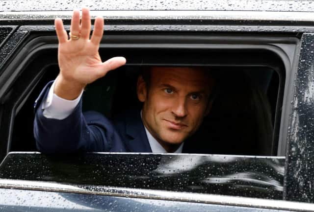 France's president Emmanuel Macron waves as he leaves after casting his vote in the second stage of French parliamentary elections at a polling station in Le Touquet, northern France on Sunday. Picture: AFP via Getty Images