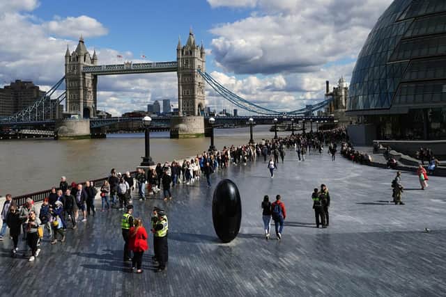 Mourners queuing to pay their respects to the Queen lying in state in Westminster Hall stretching past Tower Bridge nearly three miles away on Friday. Picture: Ian West/PA Wire