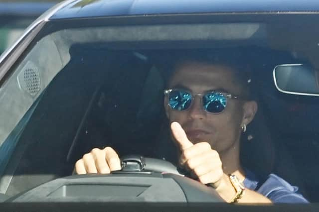 Manchester United's new signing Cristiano Ronaldo arrives to attend a training session at the Carrington. (Photo by PAUL ELLIS/AFP via Getty Images)